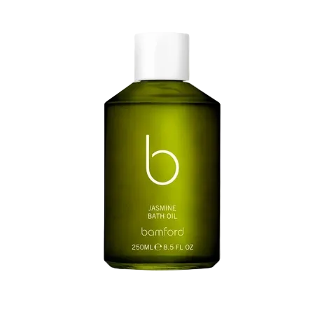Green bottle of Bamford Jasmine Bath Oil on a white background