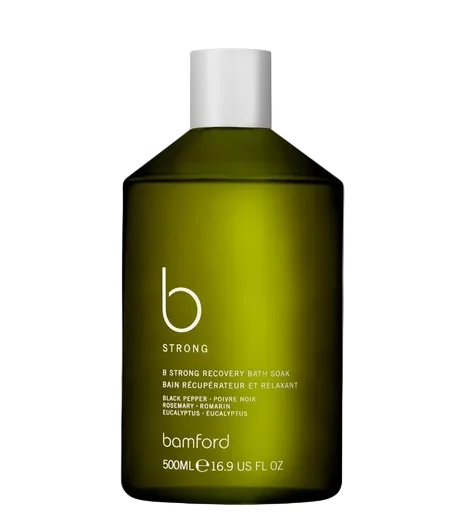 Green bottle of bamford B Strong Recovery Bath Soak on a white background